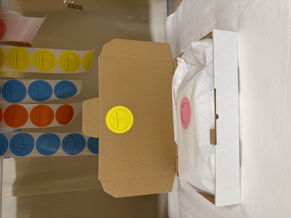 A sealed Sterling & Currency parcel, boxed and finished with branded stickers