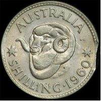1960 Shilling Clipped Planchet Error about Unc