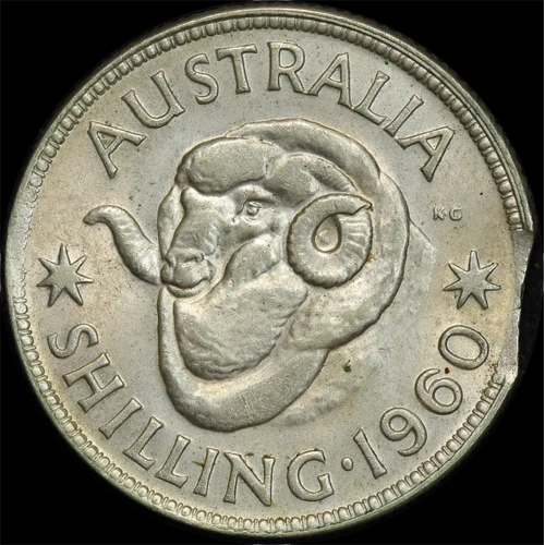 1960 Shilling Clipped Planchet Error about Unc